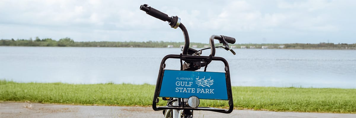 Bicycle at Gulf State Park with a scenic view of the water, inviting visitors to explore the beach resort area